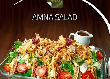 By Amna