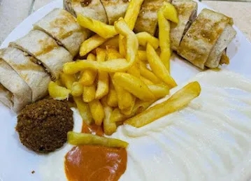 مطعم الروضة Al Rowdha Restaurant