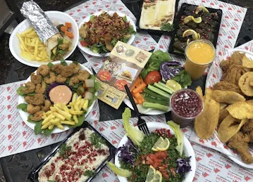 مطعم ومعجنات ومشاوي الحاره الشامية Al Hara Al Shamiya Restaurant and Grills