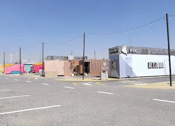 Spot - Food Trucks Park in Shamkha - سبوت - حديقة عربات الطعام في الشامخة