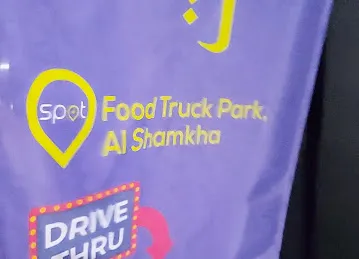 Spot - Food Trucks Park in Shamkha - سبوت - حديقة عربات الطعام في الشامخة